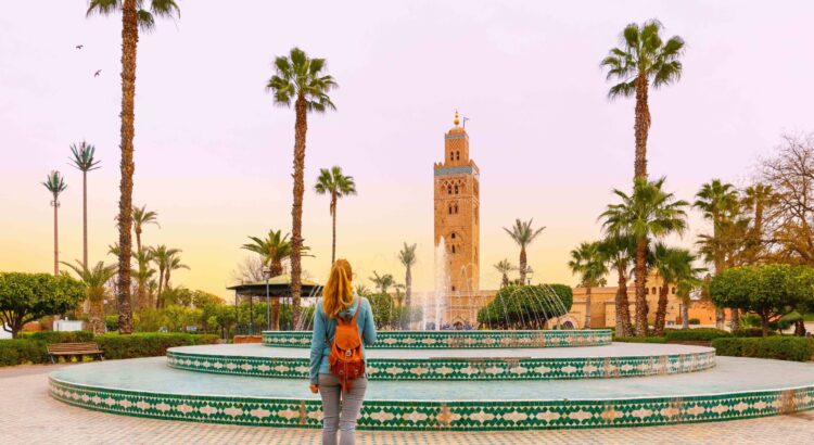 Woman,Looking,At,Koutoubia,Mosque,Minaret-tourism,In,Marrakech,,Morocco